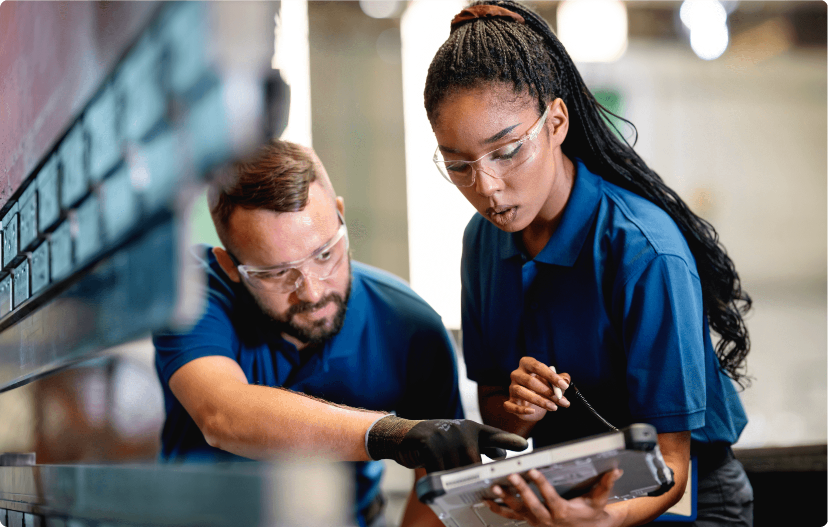 Workers reading off an mobile device.