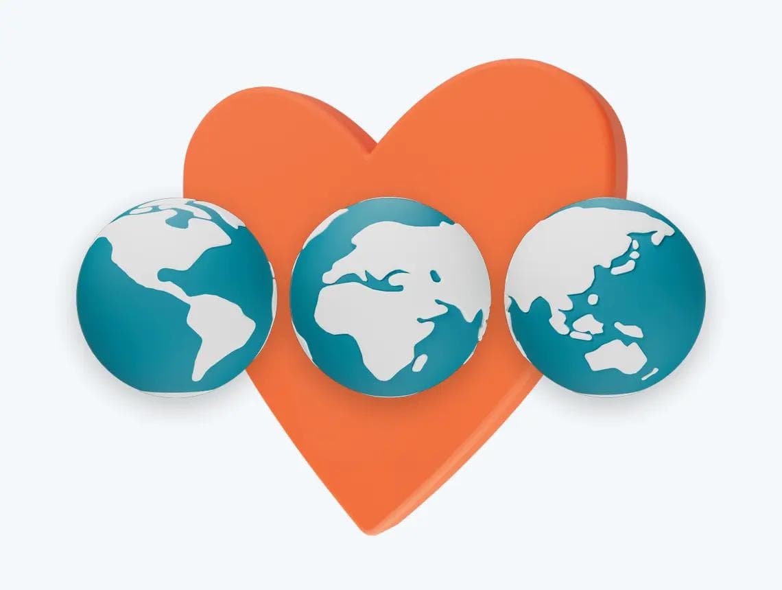 Three globes sitting on top of an orange heart.