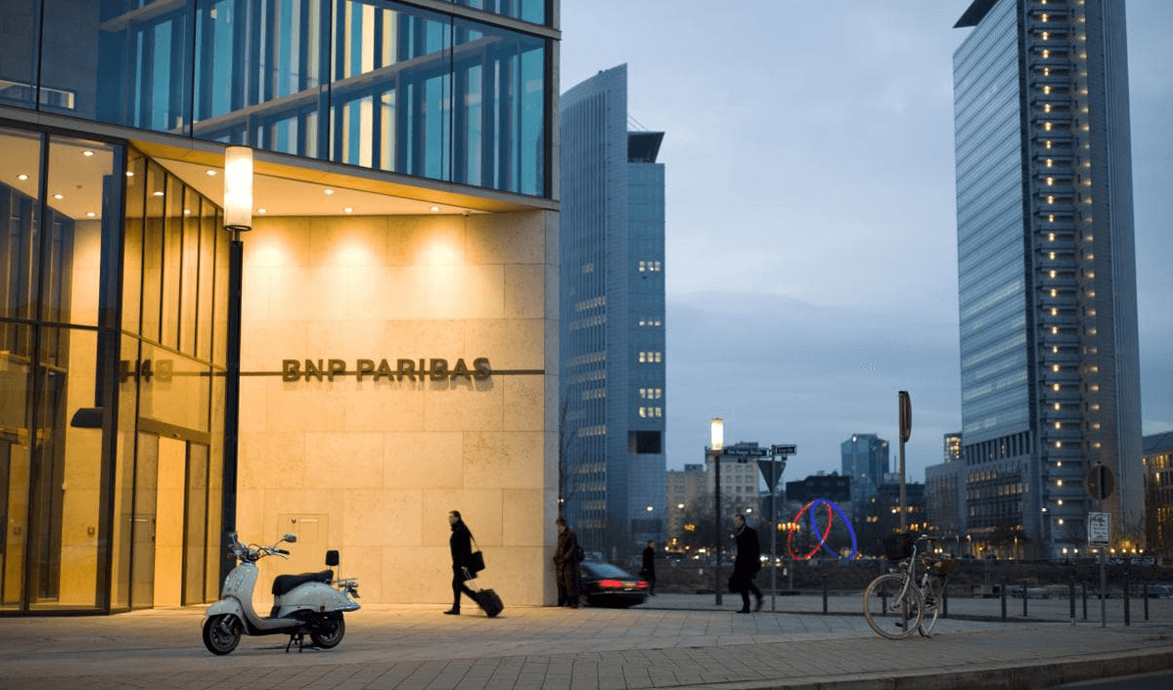 Women walking into BNP Paribas offices in city.