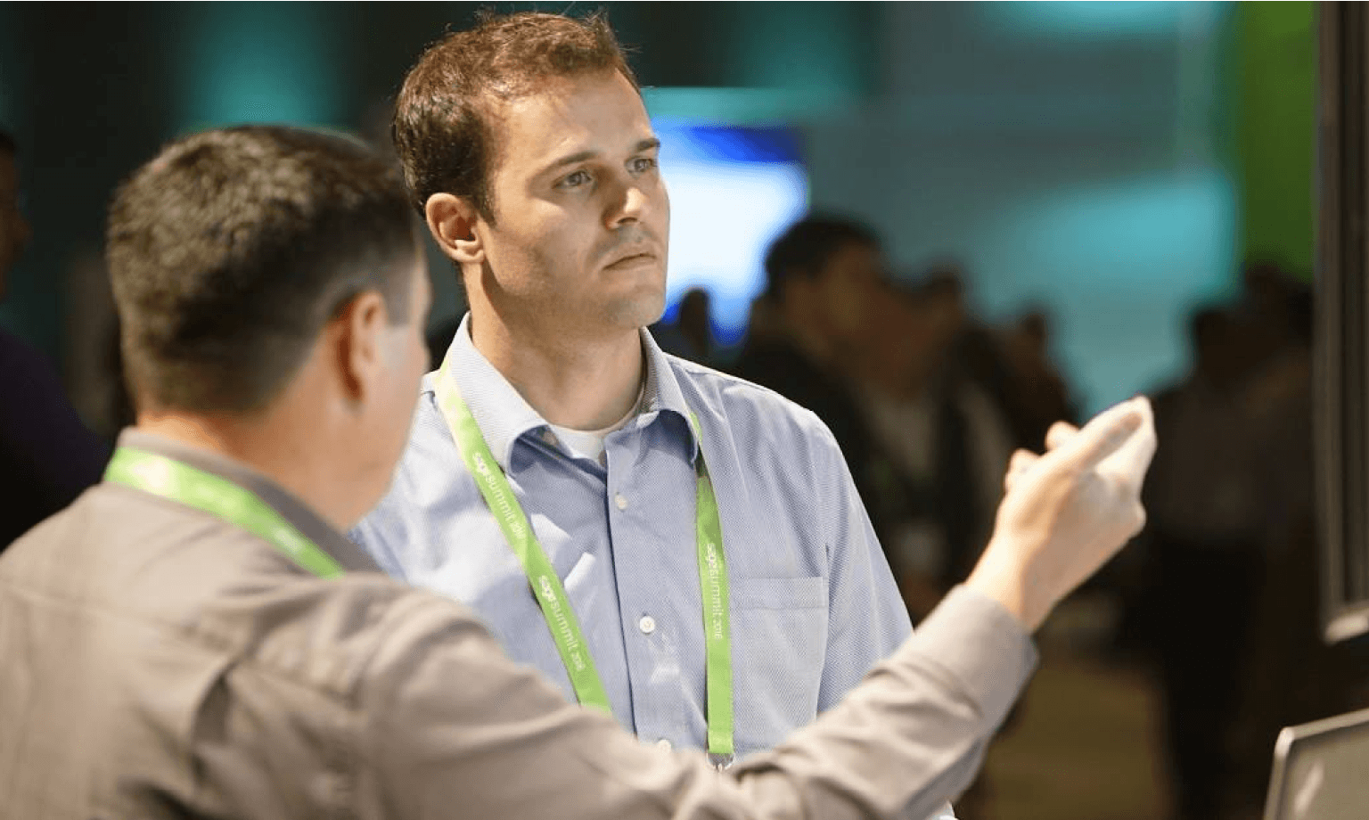 Two Sage employees talking.