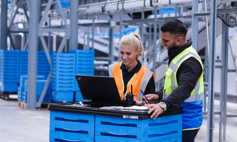 Two people working in a large facility.